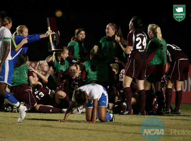 Joining a celebratory pile of humanity is the NCAA championship trophy, which Seattle Pacific just won, 1-0 over West Florida. (Courtesy NCAA)