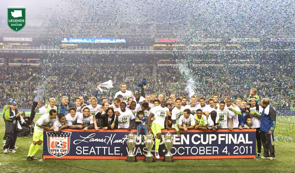 The Sounders display their third U.S. Open Cup trophy as confetti rains down at CenturyLink Field following a 2-0 win over Chicago. (Courtesy Stephen Brashear)