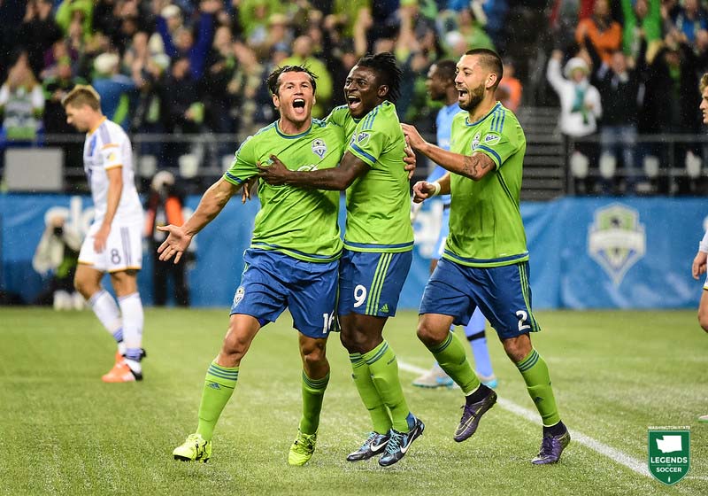 Nelson Valdez (left) joins fellow Designated Players Obafemi Martins and Clint Dempsey in celebrating his goal vs. the Galaxy in a 2015 playoff match. (Courtesy Josh Weisberg/Sounders FC)