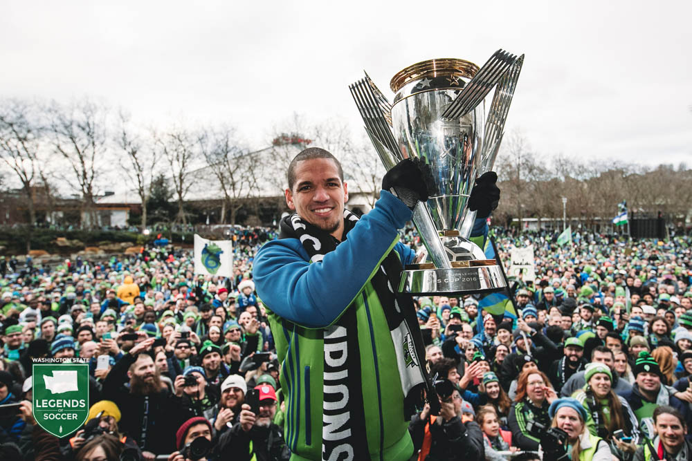 Sounders captain and original team member Osvaldo Alonso presents the MLS Cup to thousands of fans at Seattle Center. (Courtesy Sounders FC)