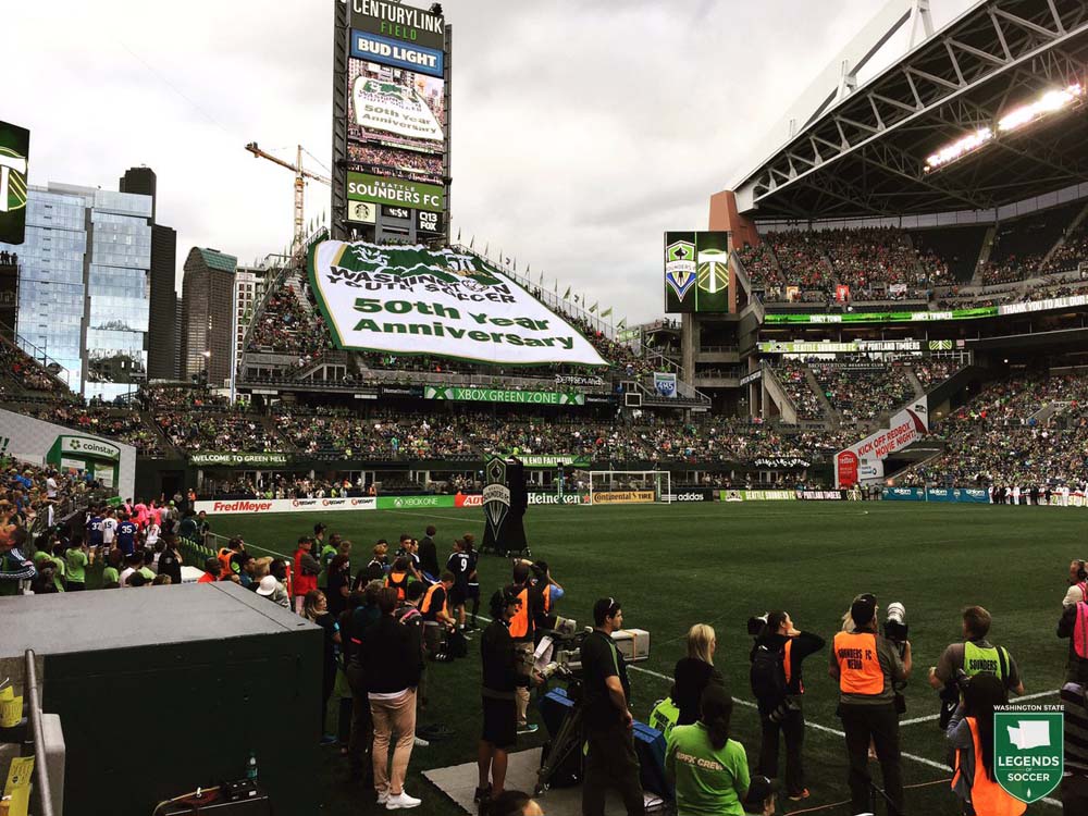 Washington Youth Soccer unveils its 50th anniversary banner at CenturyLink Field prior to the Sounders'  3-1 win over Portland, 8/21/2016.