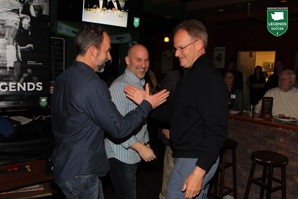 Andy (left) and Walter Schmetzer congratulate their older brother and Sounders coach Brian Schmetzer at Washington Legends of Soccer's This Is Your Life: Brian Schmetzer event at Seattle's Market Arms. (Courtesy WA Legends)