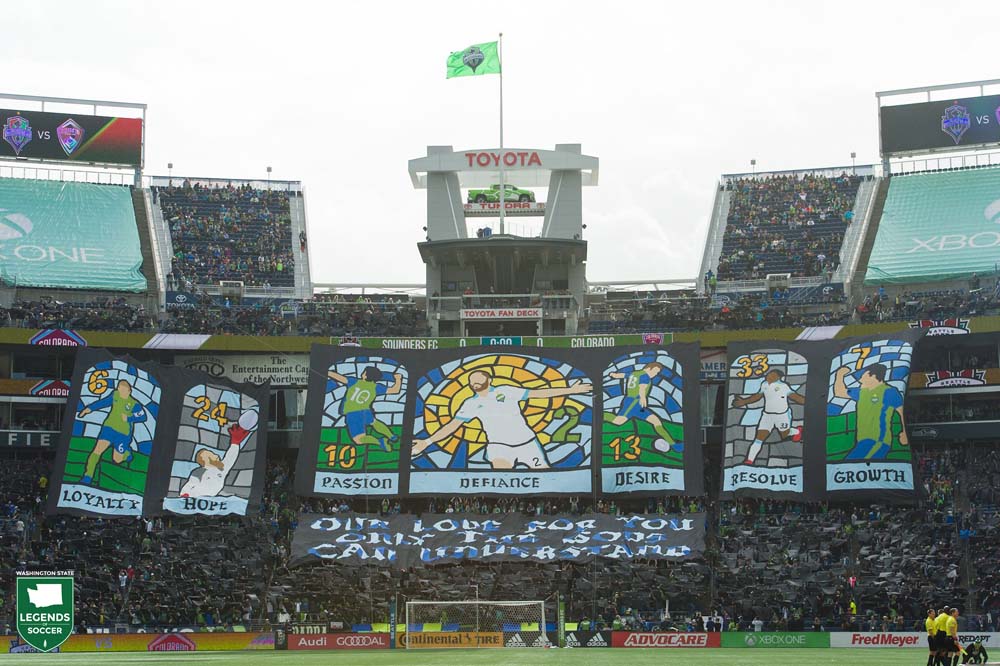 Emerald City Supporters unveil a stained glass-themed tifo prior to the 2017 Sounders victory over Colorado. (Courtesy Jane Gershovich / Sounders FC)