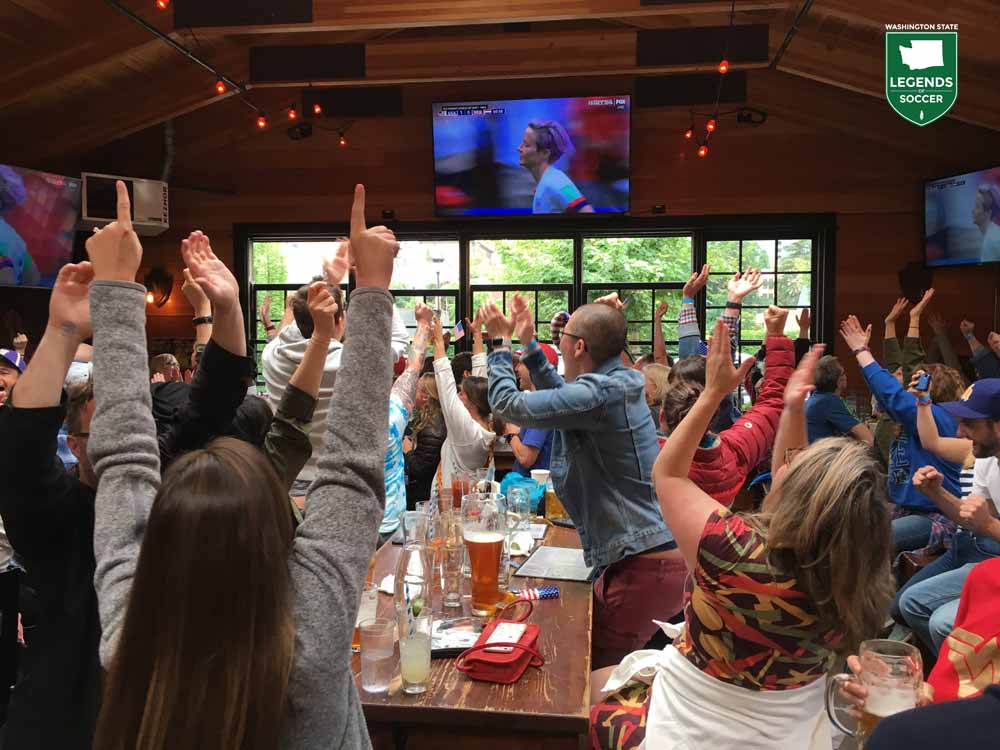Revelers celebrate Reign star Megan Rapinoe's opening goal in the 2019 World Cup final vs the Netherlands at a Reign/Washington State Legends of Soccer-hosted watch party at Seattle's Rhein Haus. (Courtesy Leann Johnson)
