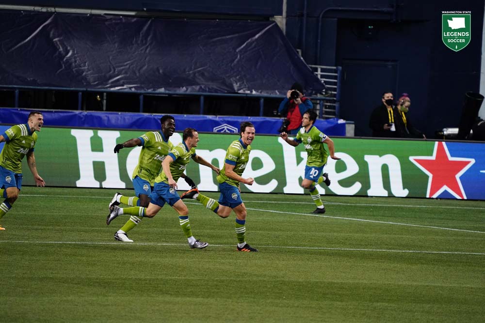 The Sounders celebrate Gustav Svensson's added-time winner in the MLS Western Conference final, a 3-2 comeback win over Minnesota. (Courtesy Mike Fiechtner/Sounders FC)