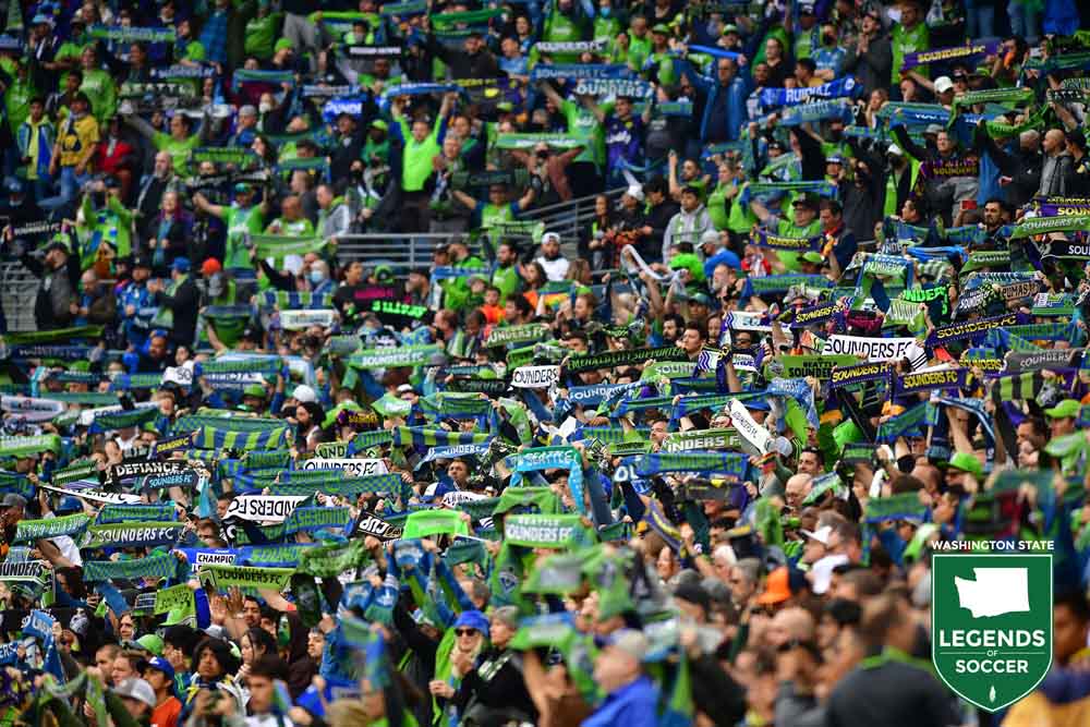 A record crowd for a Concacaf Champions League final goes scarves-up at Lumen Field prior to the Sounders-Pumas second leg of the final. (Courtesy Jane Gershovich/Sounders FC)