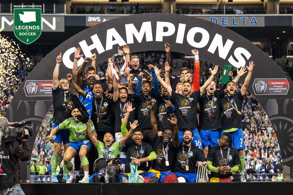 Seattle Sounders FC, America's first Concacaf Champions League champion, celebrate on the podium after defeating Pumas. (Courtesy Rod Mar/Sounders FC)