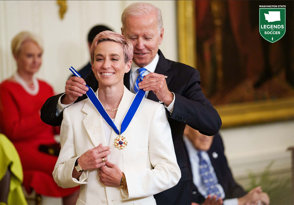 President Joe Biden presents OL Reign and U.S. National Team player Megan Rapinoe with the Medal of Freedom at The White House (Courtesy OL Reign/Josh Morgan, USA Today)