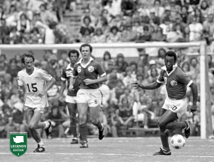 Seattle's Steve Buttle keeps an eye on Pele´, far right, as the Cosmos' Carlos Alberto and Franz Beckenbauer look on.