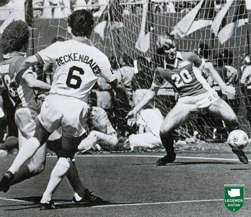 Bruce Rudroff attempts a goal line clearance for the Sounders against the Cosmos' Franz Beckenbauer. (Courtesy NASL Jerseys)