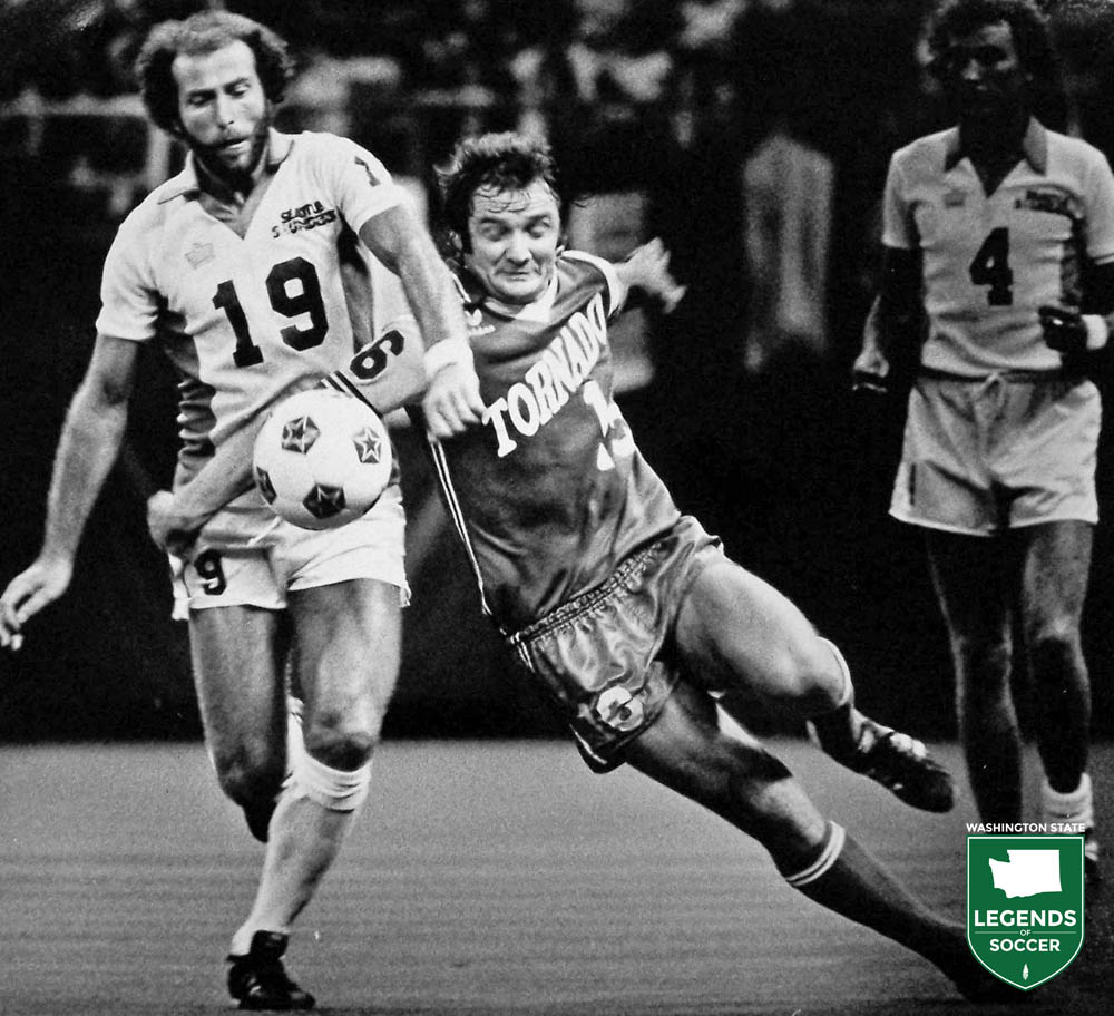 Frank Barton of the Sounders fends off Omar Gomez of the Dallas Tornado as Alan Hudson looks on. (Frank MacDonald Collection)