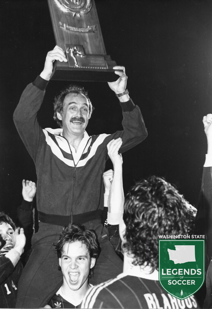 Lifting the NCAA championship trophy in Tampa was none other than Seattle Pacific coach Cliff McCrath.