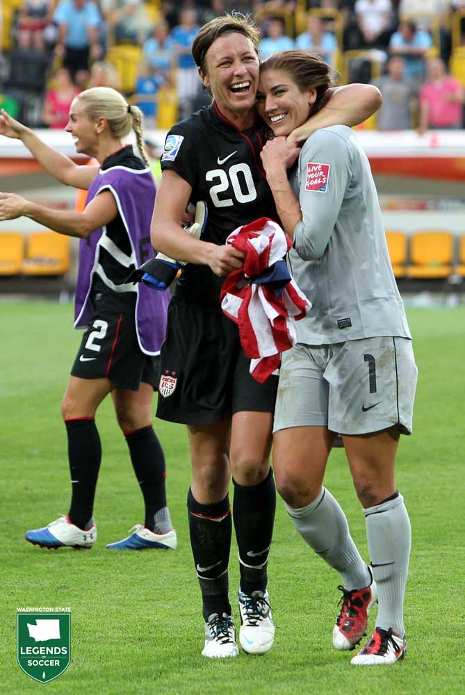 Hope Solo and Abby Wambach hug following the USA's World Cup advancement to the semifinals, 2-2 (5-3) over Brazil in Dresden, Germany. Wambach scored the equalizer in extra time added time, and Solo stopped a Brazil penalty in the tiebreaker. (Courtesy KH / ISI Photos)