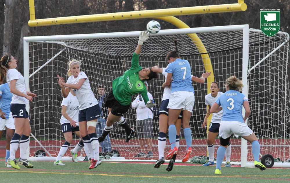 Michelle Betos clears a Chicago cross out of danger in Seattle Reign's inaugural match at Lisle, Ill. The teams finished in a 1-1 draw. (Courtesy Reign FC)