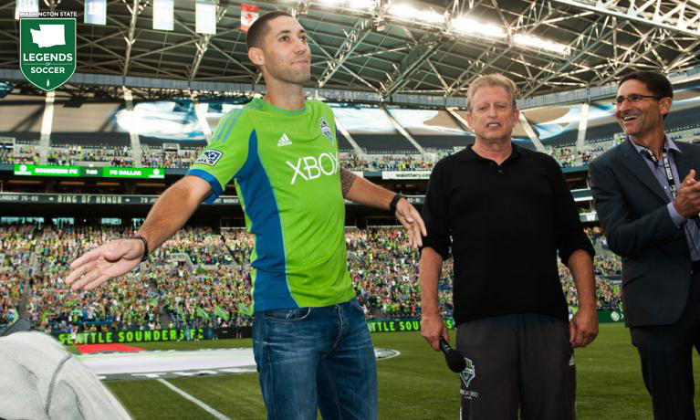Prior to the Seattle-Dallas match on August 3, Clint Dempsey makes it official, his transfer from Tottenham to Sounders FC, while owners Joe Roth and Adrian Hanauer look on. (Courtesy Sounders FC)