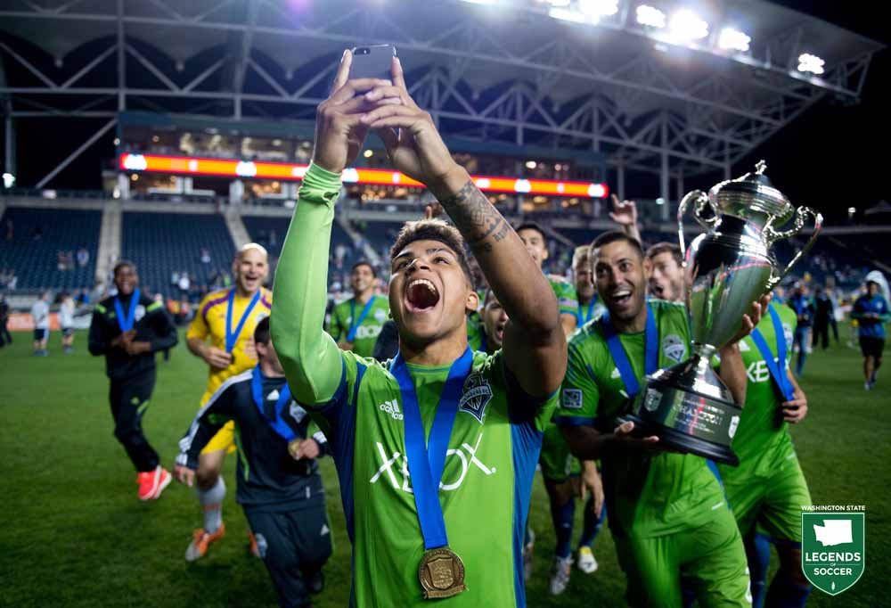 DeAndre Yedlin frames the selfie as Clint Dempsey holds the Sounders' fourth Lamar Hunt U.S. Open Cup trophy following a 3-1 extra-time victory at Philadelphia. (Courtesy Brad Smith / ISI Photos)