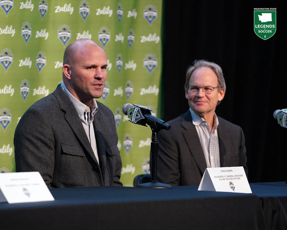 Craig Waibel is introduced as Sounders general manager as head coach Brian Schmetzer looks on. (Courtesy Jane Gershovich/Sounders FC)