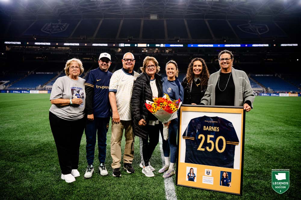 Accompanied by family, Lauren Barnes is honored by the Seattle Reign for her 250th club regular season appearance in October 2025. Barnes is the first NWSL player to reach the milestone. (Jane Gershovich/Seattle Reign)