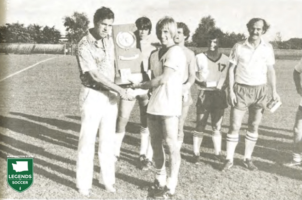 Seattle Pacific captain Jamie Deming is presented the NCAA championship trophy after defeating Alabama A&M in Miami. (Courtesy Seattle Pacific archives)
