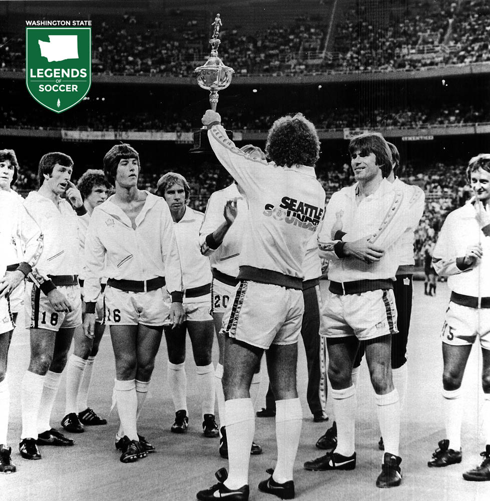 Sounders captain Alan Hudson lifts the 1980 Western Division championship trophy. (Frank MacDonald Collection)