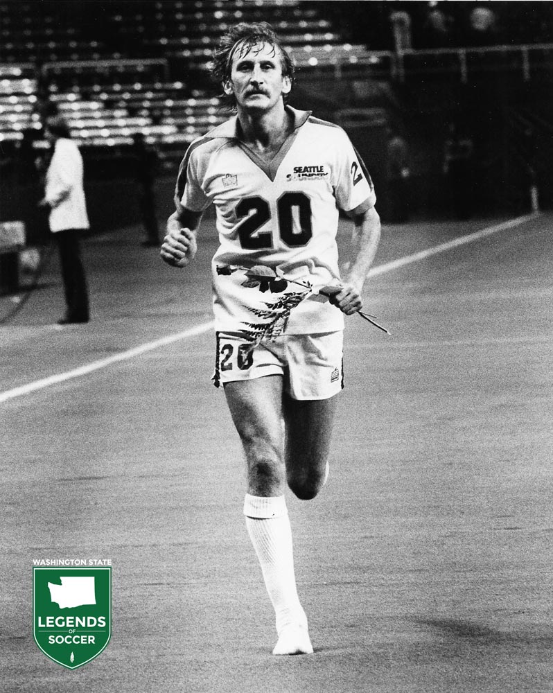 Fan favorite Tommy Hutchison of the Sounders clutches a rose given by fans during his postgame lap of honor. (Frank MacDonald Collection)