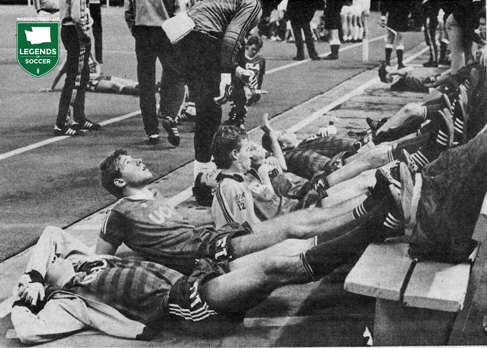 UCLA players rest and stretch between overtime periods of the NCAA final in the Kingdome. (Courtesy UCLA)
