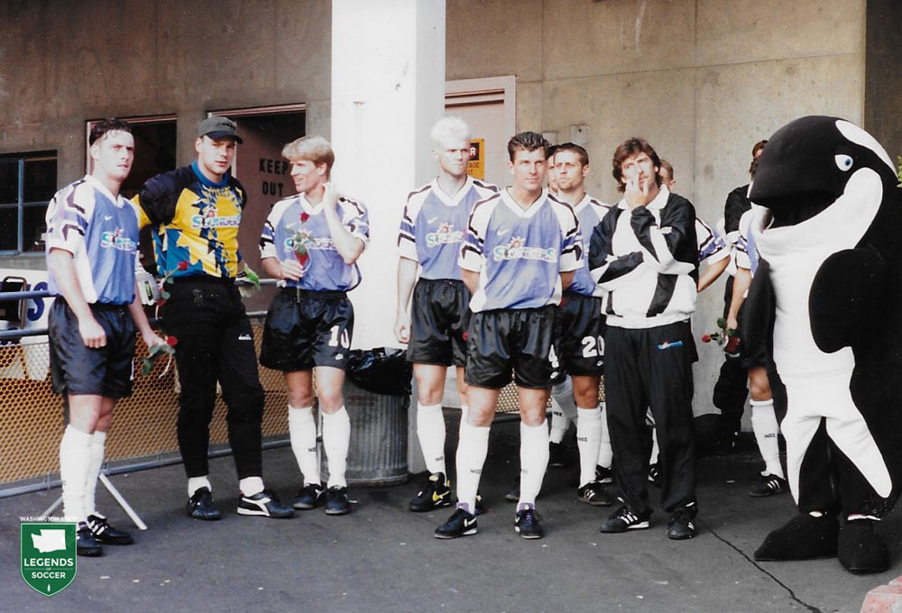 Sounders players (l to r) James Dunn, Marcus Hahnemann, Peter Hattrup, Wade Webber, Neil Megson and Gary Heale hold roses for some of the 11,874 fans attending the final regular season game versus Vancouver.